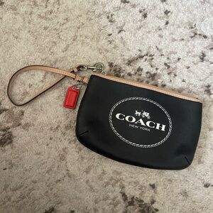 32. Coach wristlet